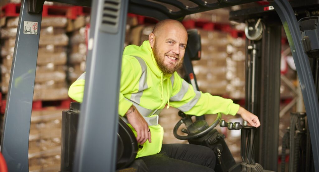 fork lift truck driver in warehouse