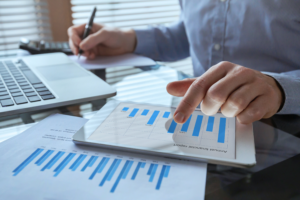 Businessman working with financial report charts, business analytics and KPI