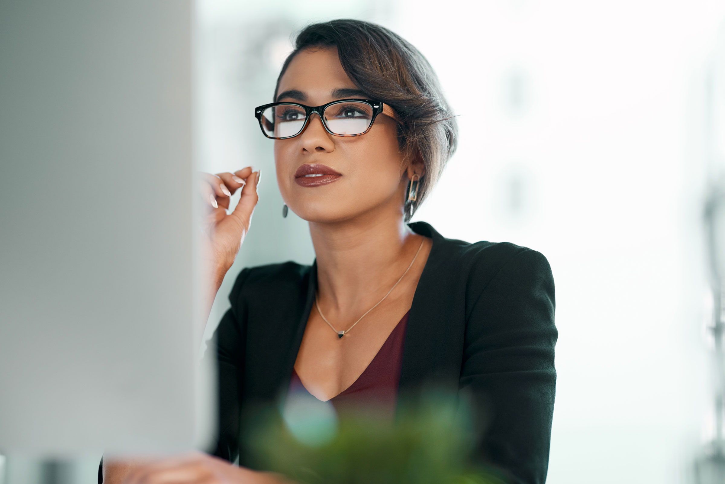 Woman looks at monitor