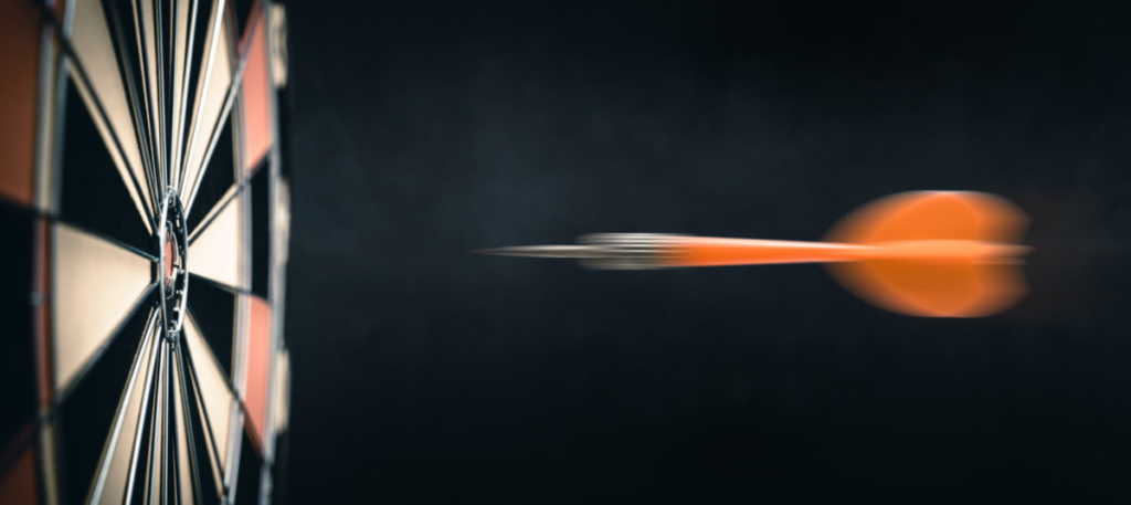 Dart flying towards dart board