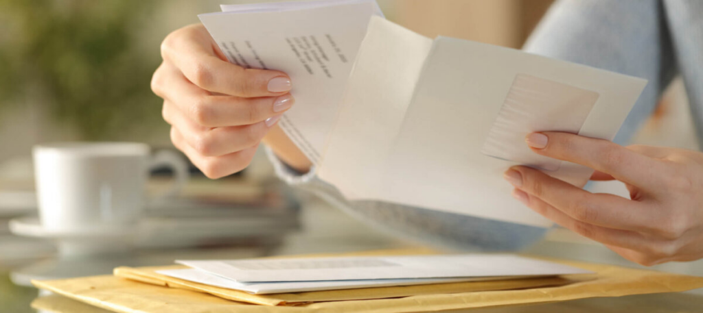 Woman's hands holding and reading letter