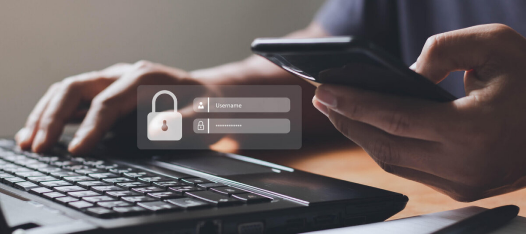 person typing in login information