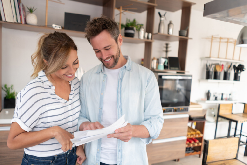 couple smiling at a letter