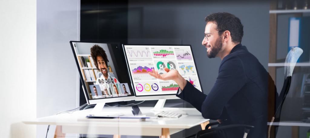 Man on a video call while working with data