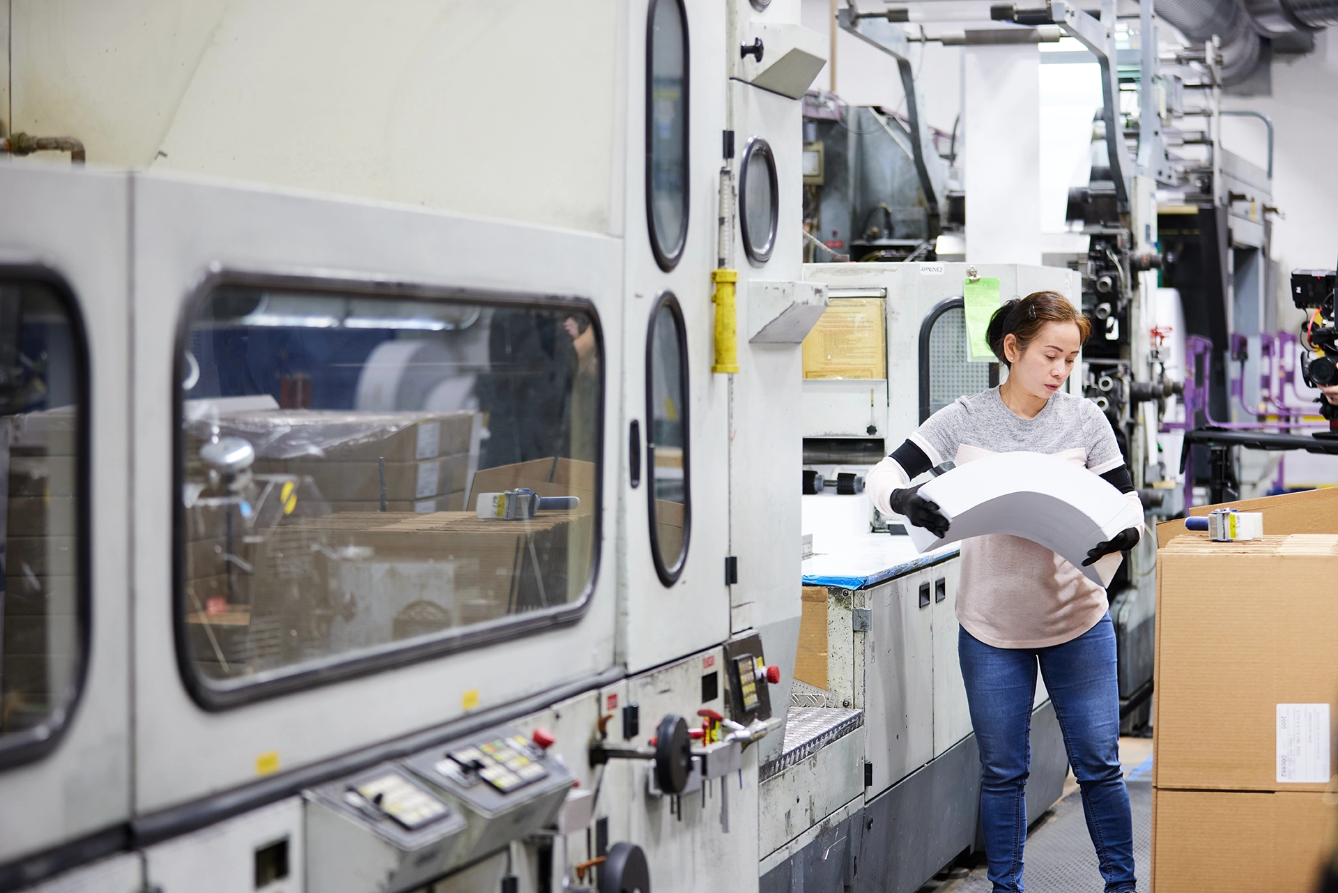 women operating a sustainable manufacturing print machine