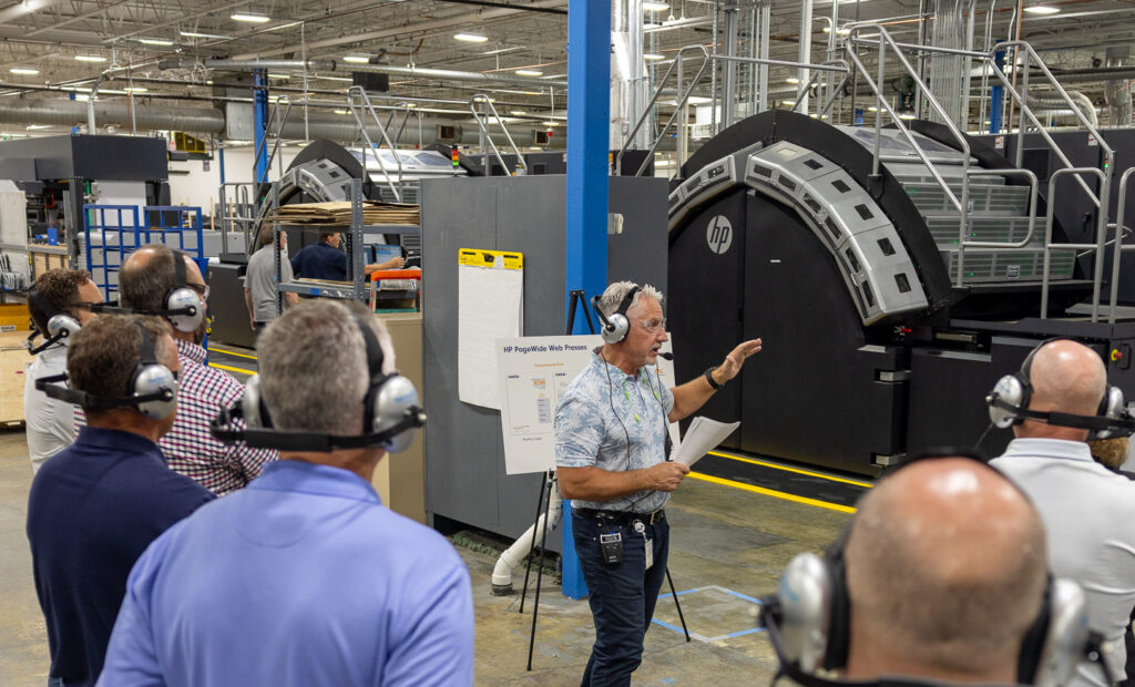 man giving presentation in warehouse